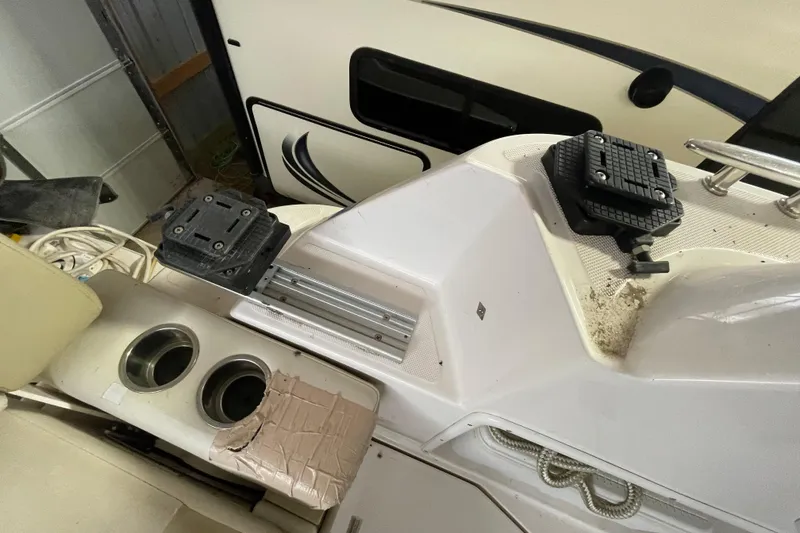 Slide: The Image of Interior view of a 2013 Regal 35 Sport Coupe boat with cup holders and mounting brackets. - 41