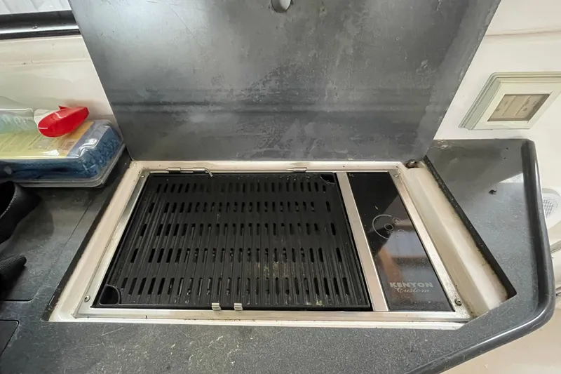 Slide: The Image of Built-in Kenyon grill on 2013 Regal 35 Sport Coupe yacht kitchen counter. - 43