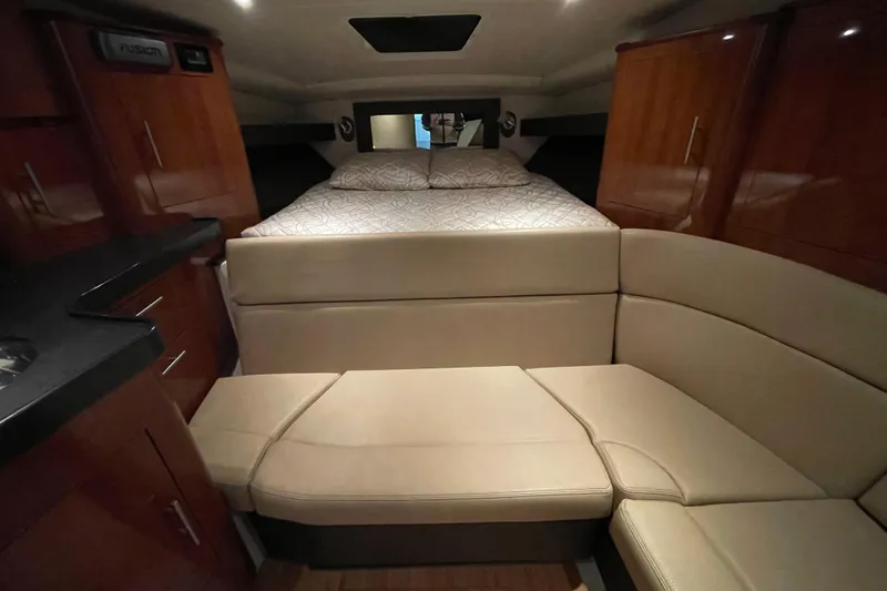 Slide: The Image of Luxurious interior of 2013 Regal 35 Sport Coupe with cozy bed and seating area. - 45