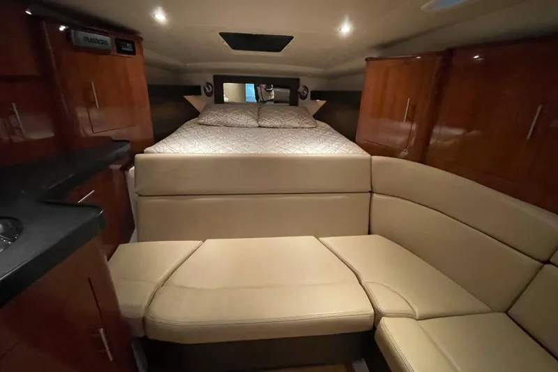 Slide: The Image of Luxurious interior of 2013 Regal 35 Sport Coupe with cozy bed and seating area. - 52