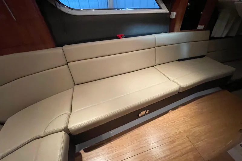 Slide: The Image of Beige leather seating in 2013 Regal 35 Sport Coupe interior. - 53