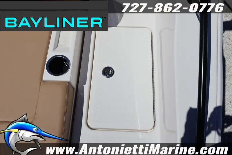 Slide: The Image of 2026 Bayliner D22 boat interior with cup holder and storage compartment. - 14