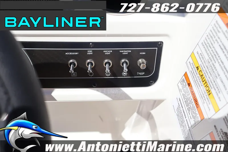 Slide: The Image of Control panel of 2026 Bayliner D22 boat with switches and caution labels. - 23
