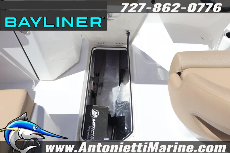 Slide: The Image of 2026 Bayliner D22 boat interior with storage compartment and Mercury propeller box. - 29