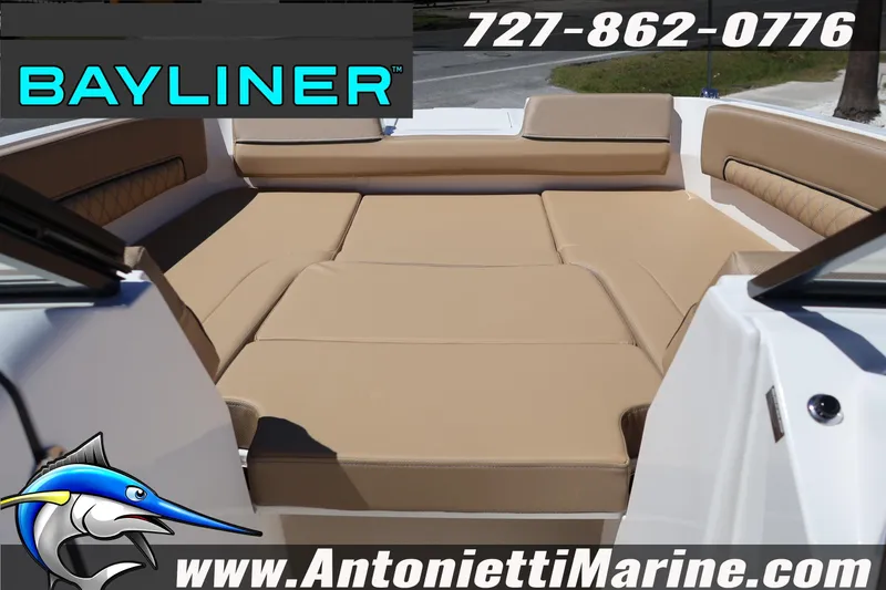Slide: The Image of 2026 Bayliner D22 boat interior with tan seating, Antonietti Marine branding. - 32