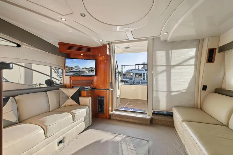Slide: The Image of Luxurious interior of 2008 Cruisers Yachts 447 Sport Sedan with plush seating and TV. - 11