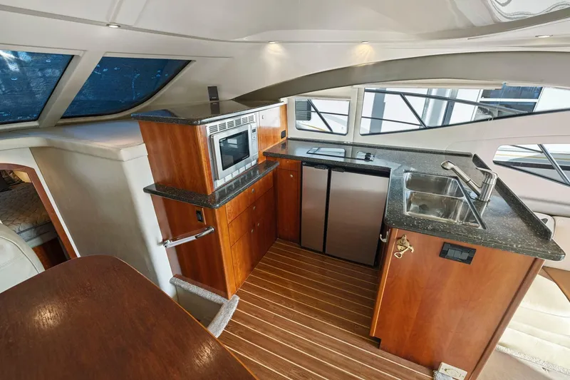 Slide: The Image of Luxurious 2008 Cruisers Yachts 447 Sport Sedan kitchen with modern amenities and sleek design. - 13