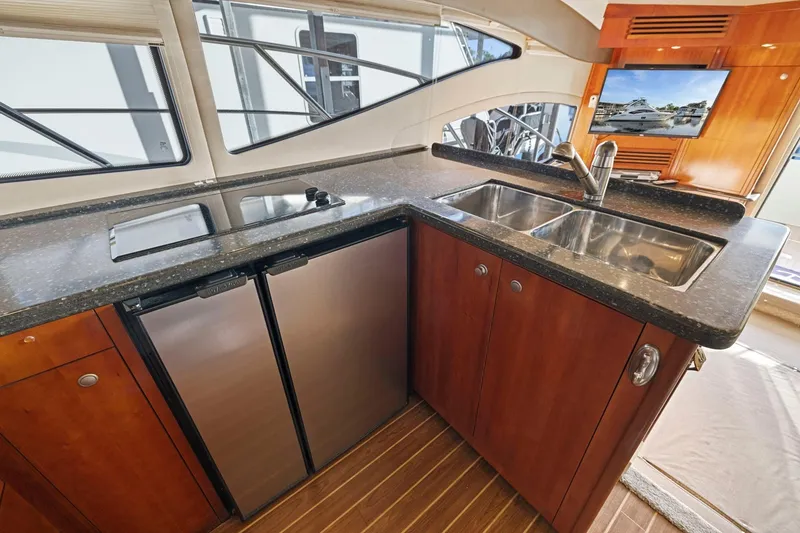 Slide: The Image of Luxurious kitchen area in 2008 Cruisers Yachts 447 Sport Sedan with modern amenities. - 14