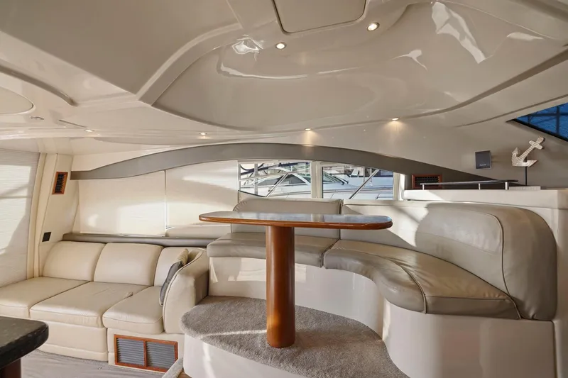 Slide: The Image of Luxurious interior of 2008 Cruisers Yachts 447 Sport Sedan with elegant seating and table. - 15