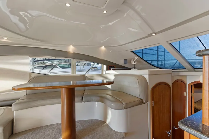 Slide: The Image of Luxurious interior of 2008 Cruisers Yachts 447 Sport Sedan with elegant seating and table. - 16