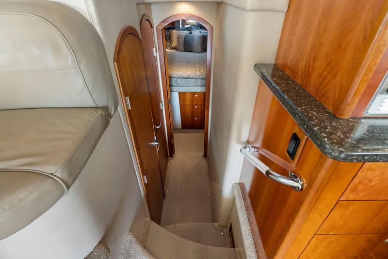 Slide: The Image of Interior of 2008 Cruisers Yachts 447 Sport Sedan, featuring elegant wood finishes and cozy cabin. - 17