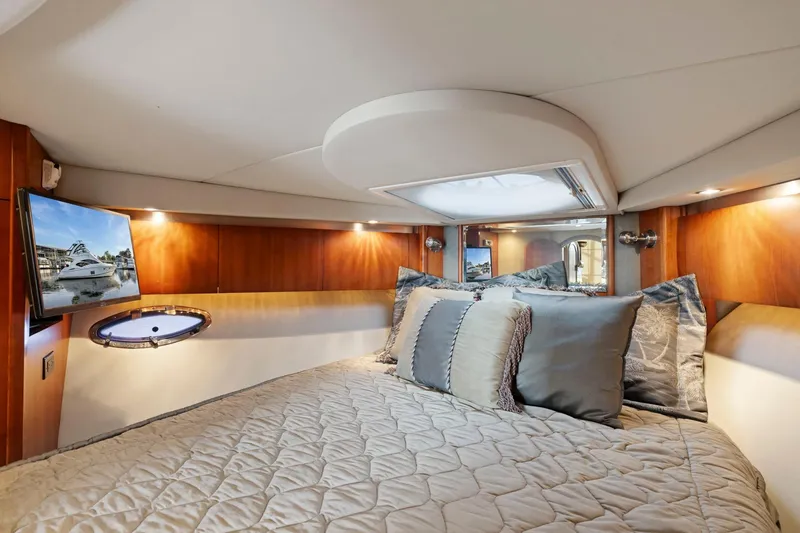 Slide: The Image of Luxurious cabin interior of 2008 Cruisers Yachts 447 Sport Sedan with cozy bedding and TV. - 19