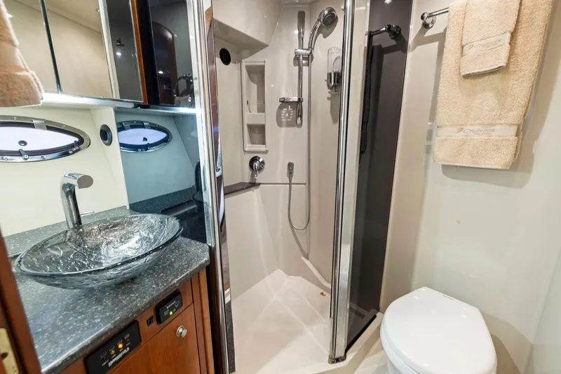 Slide: The Image of Luxurious bathroom in 2008 Cruisers Yachts 447 Sport Sedan with modern fixtures and elegant design. - 21