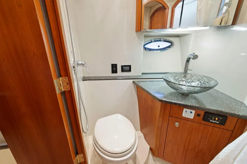 Slide: The Image of Luxurious bathroom in 2008 Cruisers Yachts 447 Sport Sedan with glass sink and modern fixtures. - 22
