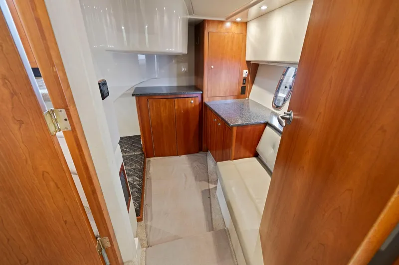 Slide: The Image of Interior of 2008 Cruisers Yachts 447 Sport Sedan with wood cabinetry and seating. - 23