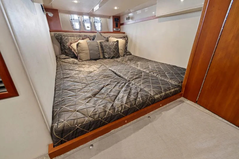 Slide: The Image of Luxurious cabin interior of 2008 Cruisers Yachts 447 Sport Sedan with cozy bedding. - 24
