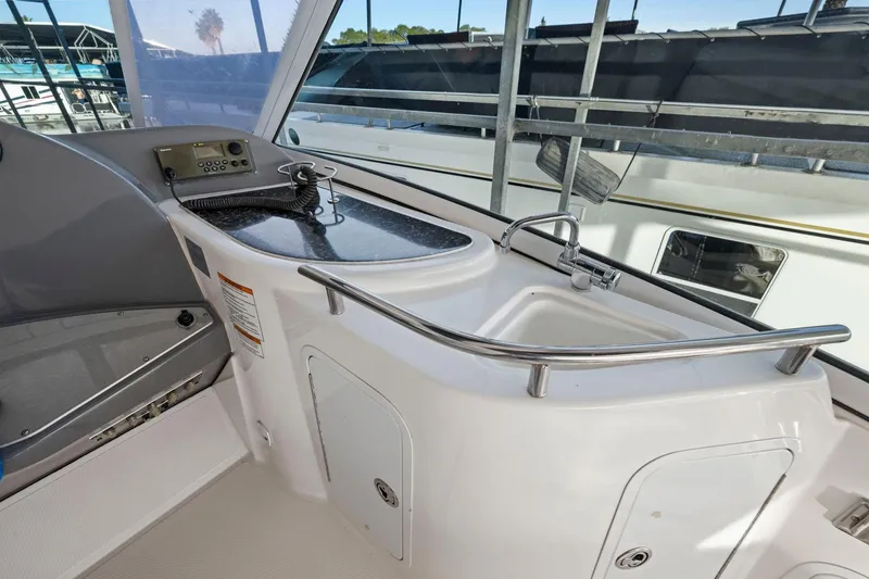 Slide: The Image of 2008 Cruisers Yachts 447 Sport Sedan cockpit with sink and control panel. - 27
