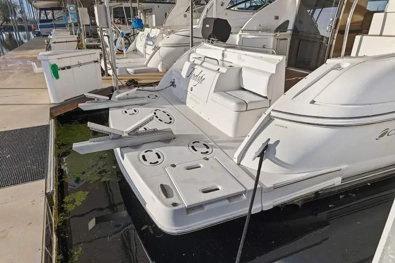 Slide: The Image of 2008 Cruisers Yachts 447 Sport Sedan docked at marina with swim platform. - 3