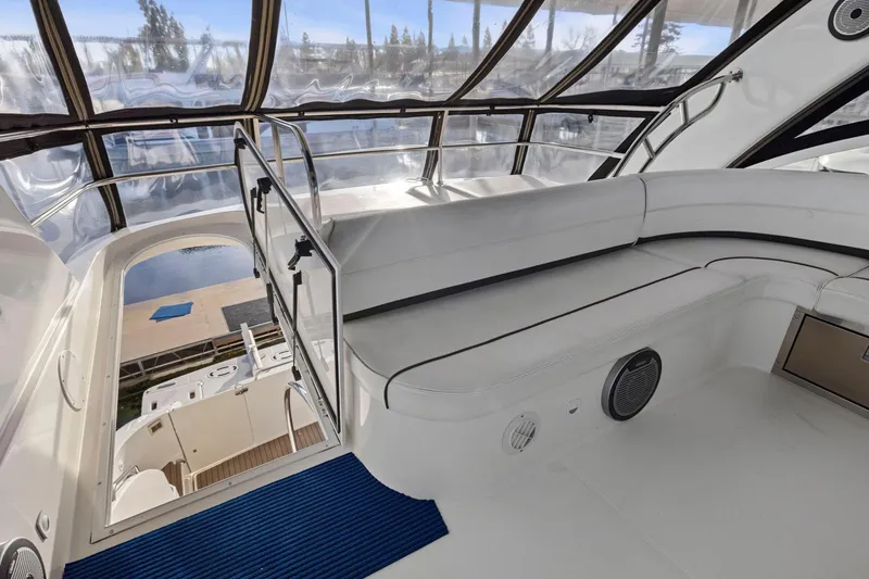 Slide: The Image of 2008 Cruisers Yachts 447 Sport Sedan interior with white seating and panoramic windows. - 30