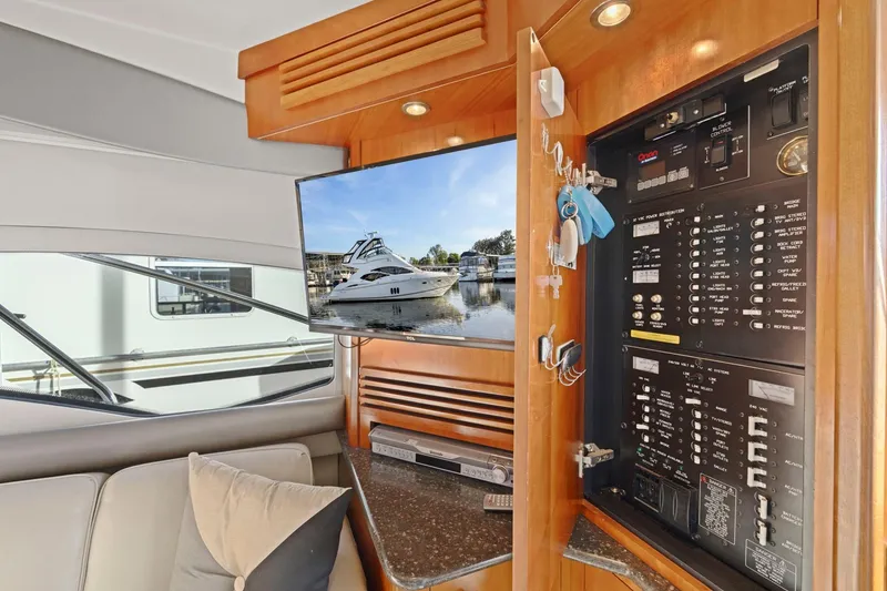 Slide: The Image of Interior of 2008 Cruisers Yachts 447 Sport Sedan with control panel and TV display. - 33