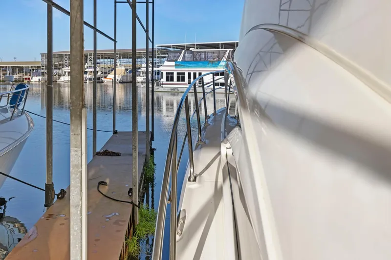 Slide: The Image of 2008 Cruisers Yachts 447 Sport Sedan docked at marina, side view. - 35