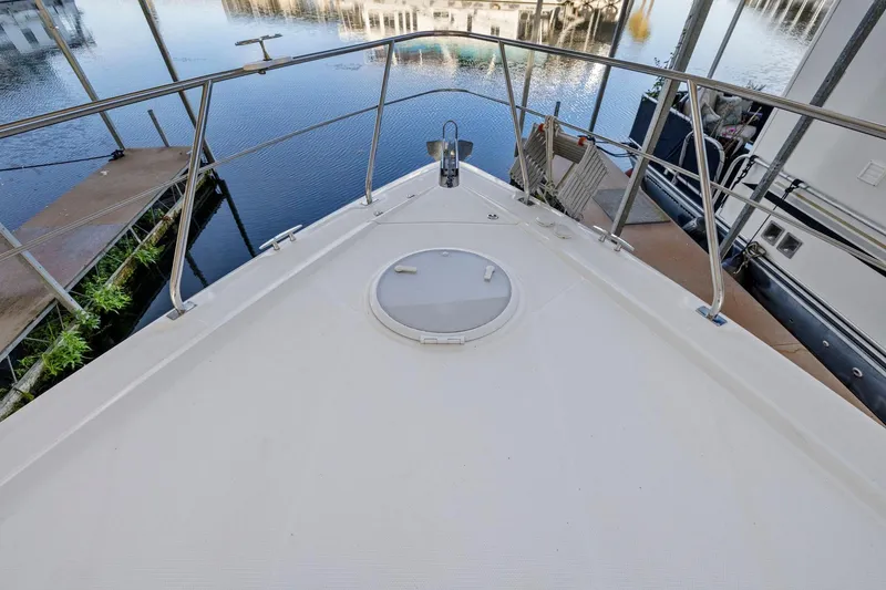 Slide: The Image of Bow view of 2008 Cruisers Yachts 447 Sport Sedan at marina dock. - 38