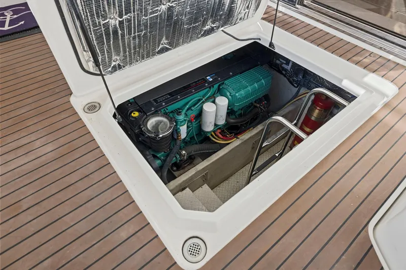 Slide: The Image of Engine compartment of 2008 Cruisers Yachts 447 Sport Sedan, showcasing marine engine details. - 46