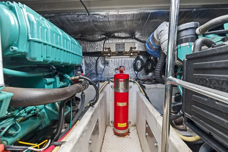 Slide: The Image of Engine room of 2008 Cruisers Yachts 447 Sport Sedan with fire extinguisher and machinery. - 47