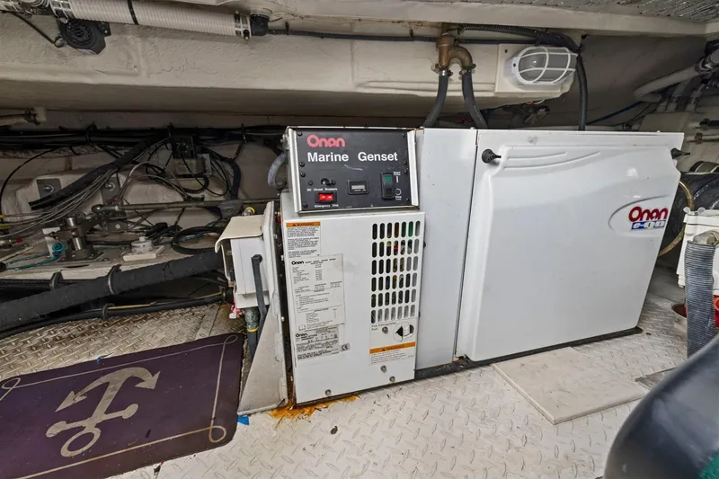 Slide: The Image of Onan marine generator in 2008 Cruisers Yachts 447 Sport Sedan engine room. - 48