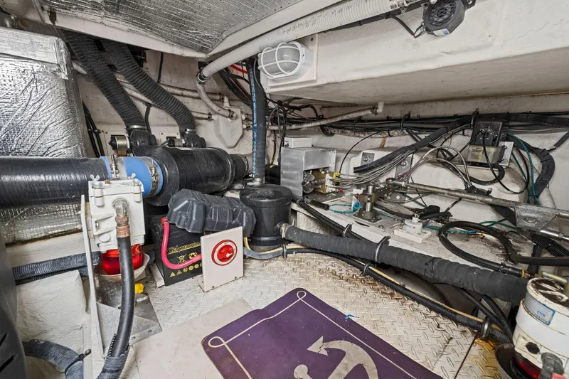 Slide: The Image of Engine room of 2008 Cruisers Yachts 447 Sport Sedan with visible wiring and components. - 49