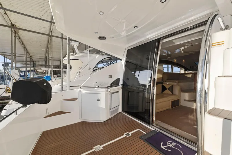 Slide: The Image of 2008 Cruisers Yachts 447 Sport Sedan with luxurious interior and spacious deck area. - 5