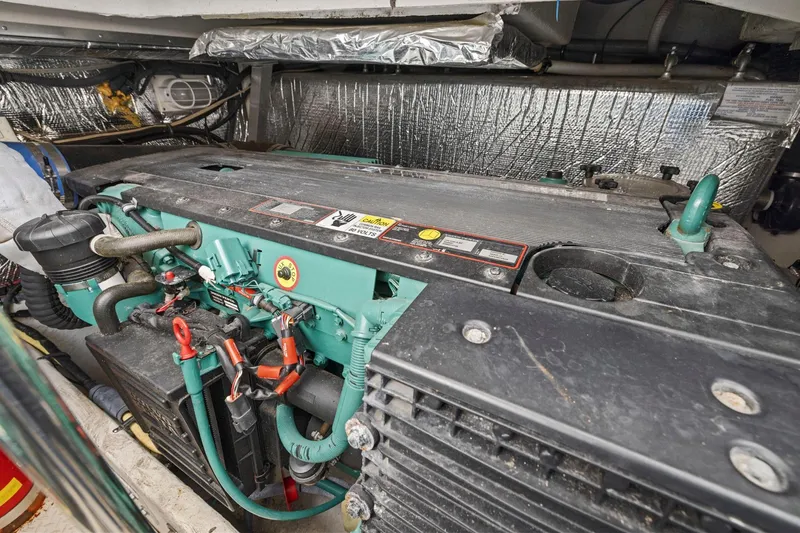 Slide: The Image of Engine compartment of 2008 Cruisers Yachts 447 Sport Sedan, showcasing mechanical components. - 52