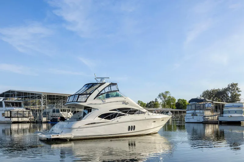 Slide: The Image of 2008 Cruisers Yachts 447 Sport Sedan docked in a marina under clear skies. - 58