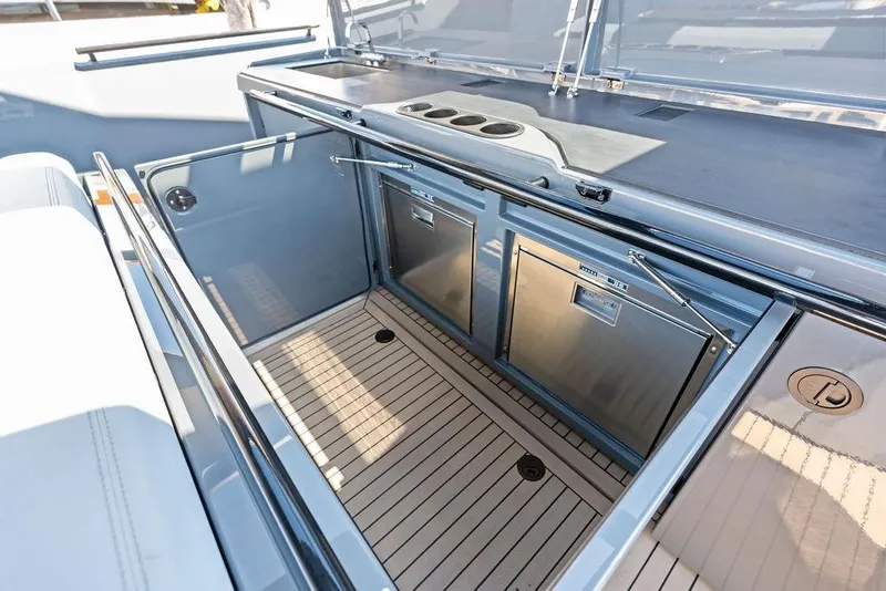 Slide: The Image of 2024 Vanquish Yachts VQ55 yacht kitchen with modern appliances and sleek design. - 10