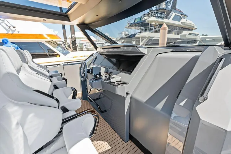 Slide: The Image of 2024 Vanquish Yachts VQ55 cockpit with sleek design and luxurious seating. - 11