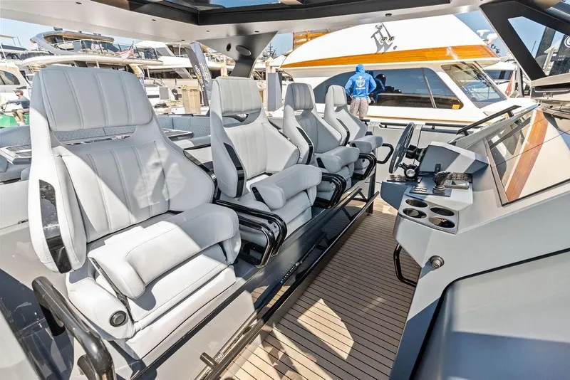 Slide: The Image of Luxurious interior of 2024 Vanquish Yachts VQ55 with modern seating and sleek dashboard. - 12