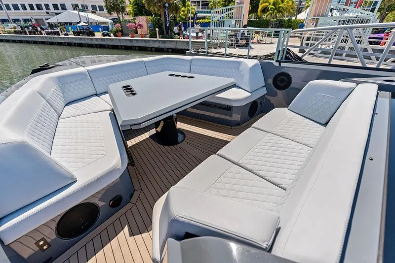 Slide: The Image of Luxurious seating area on 2024 Vanquish Yachts VQ55 with elegant design and spacious layout. - 15