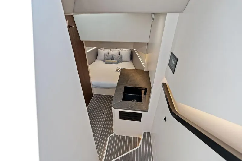 Slide: The Image of Luxurious interior of 2024 Vanquish Yachts VQ55, featuring modern design and cozy sleeping area. - 17