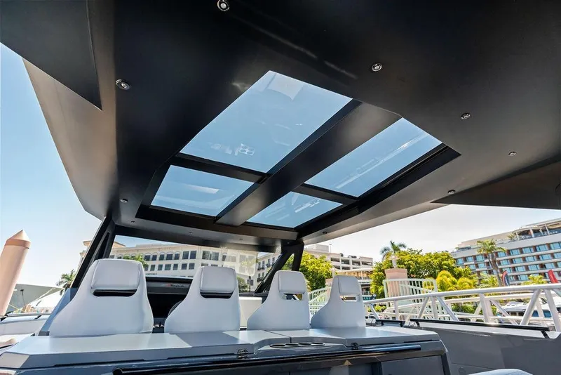 Slide: The Image of 2024 Vanquish Yachts VQ55 interior with sleek design and panoramic sunroof. - 30