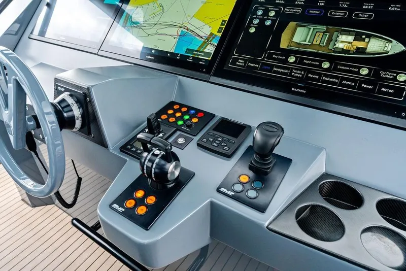 Slide: The Image of 2024 Vanquish Yachts VQ55 helm with advanced navigation and control systems. - 32