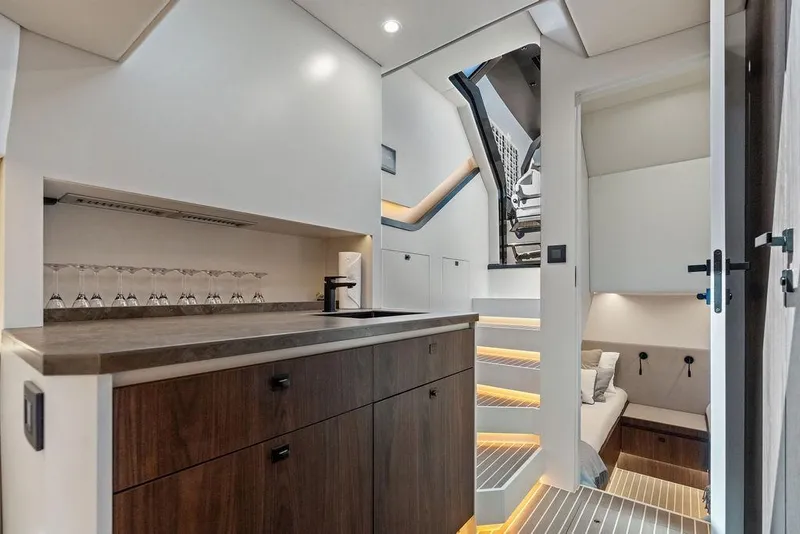 Slide: The Image of Luxurious interior of 2024 Vanquish Yachts VQ55, featuring modern kitchen and cozy cabin space. - 35