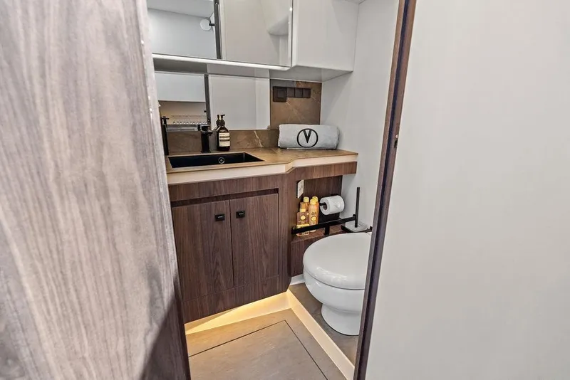 Slide: The Image of Luxurious bathroom interior of 2024 Vanquish Yachts VQ55, featuring modern fixtures and elegant design. - 40