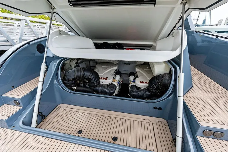 Slide: The Image of 2024 Vanquish Yachts VQ55 engine compartment with open hatch, showcasing sleek design and engineering. - 47