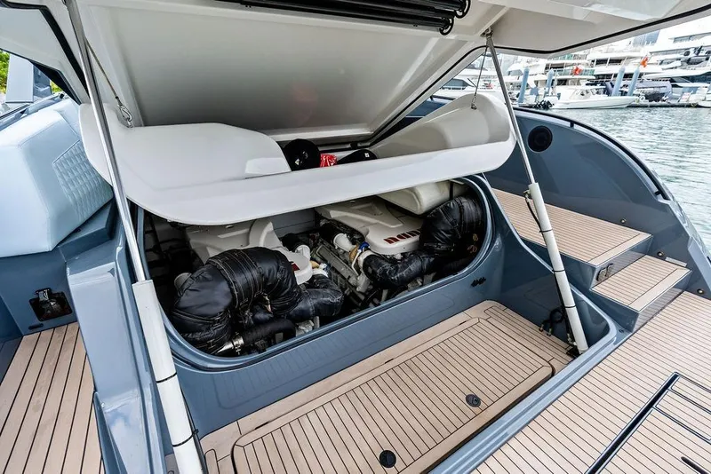 Slide: The Image of 2024 Vanquish Yachts VQ55 engine compartment with open hatch, showcasing modern design. - 48