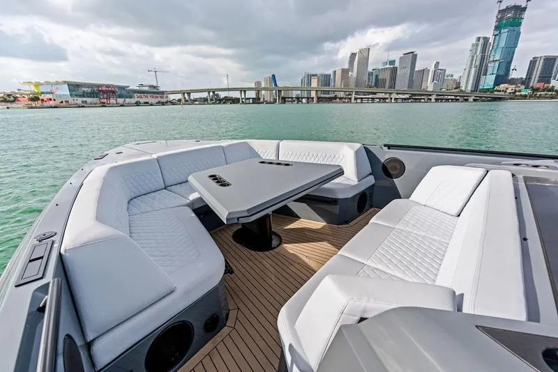 Slide: The Image of Luxurious 2024 Vanquish Yachts VQ55 with elegant seating, overlooking a city skyline. - 57