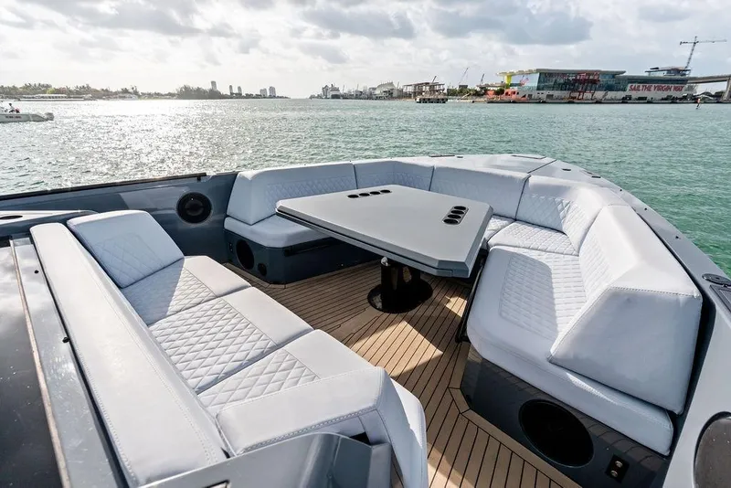 Slide: The Image of Luxurious seating area on 2024 Vanquish Yachts VQ55, overlooking serene waters. - 58