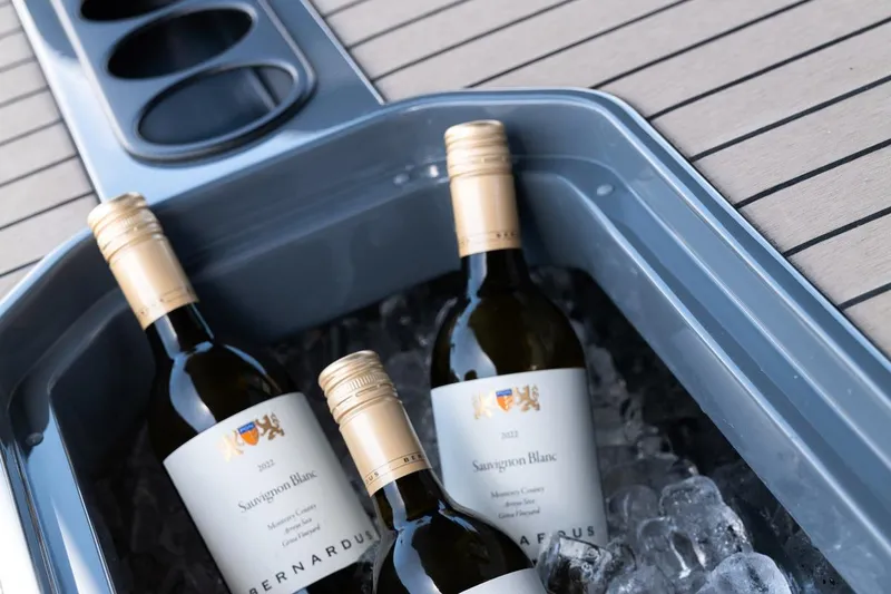 Slide: The Image of Bottles of Sauvignon Blanc on ice aboard 2024 Vanquish Yachts VQ 55. - 6