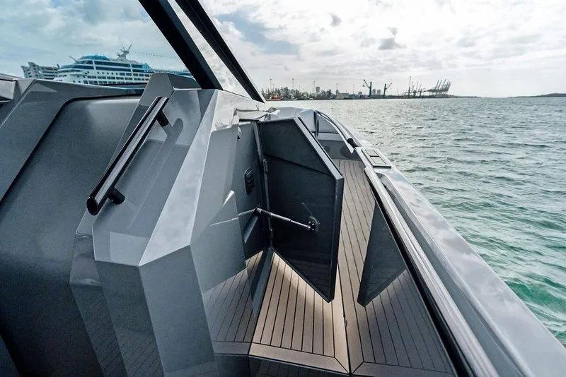 Slide: The Image of 2024 Vanquish Yachts VQ55 luxury yacht deck with sleek design and ocean view. - 61