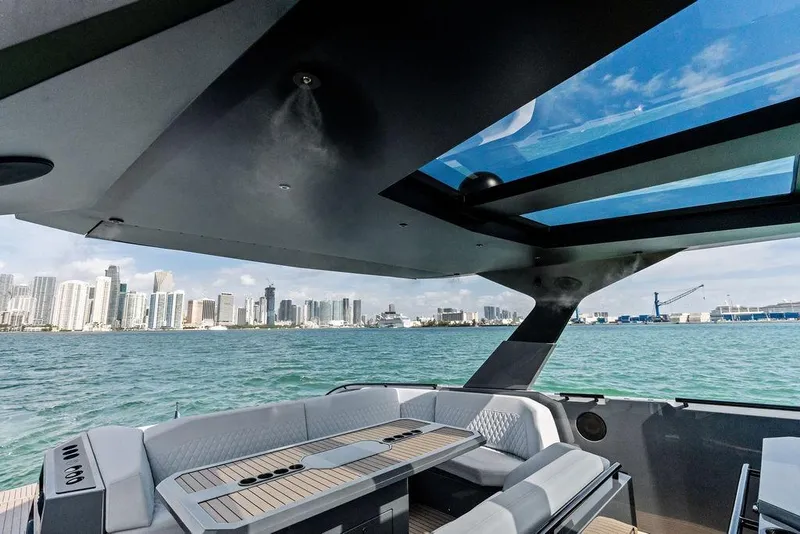 Slide: The Image of 2024 Vanquish Yachts VQ55 interior with city skyline view through glass roof. - 65