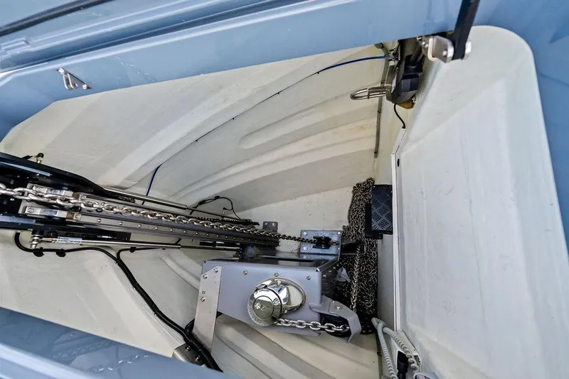 Slide: The Image of Anchor compartment of 2024 Vanquish Yachts VQ55, showcasing chain and mechanical components. - 68